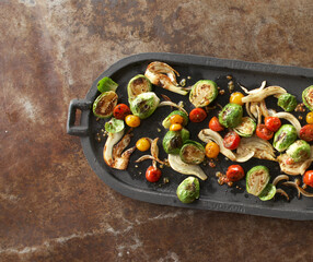 Veggies on iron skillet and metal surface