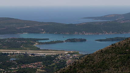 Fototapeta na wymiar breathtaking view of an airplane in a coastal area Montenegro / Tivat