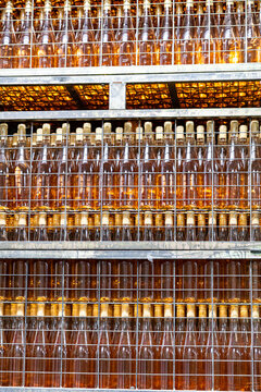 Stacked bottles of artisanal txakoli wine in winery.