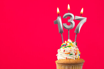 Burning candle number 137 - Birthday card with cupcake