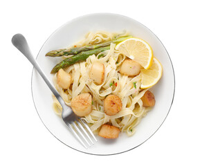 Delicious scallop pasta with asparagus, lemon and fork isolated on white, top view
