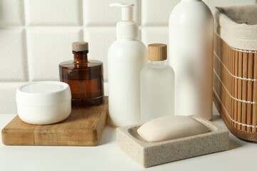 Fototapeta na wymiar Bath accessories. Personal care products on white table, closeup