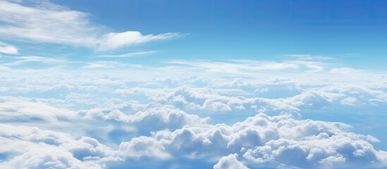 Gazing out the airplane window, I marveled at the stunning electric blue sky contrasting with fluffy cumulus clouds drifting over the horizon and vast ocean below
