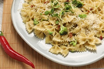 Vegetarian meal. Tasty pasta with vegetables and cheese on table, closeup