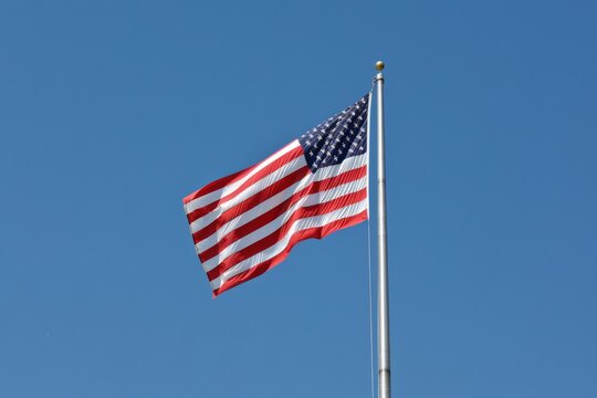 The American flag, symbolizing the essence of Independence Day, copy space