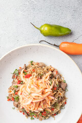 Arroz Chaufa en fondo de piedra con decoración de Ajies  Pimientos, 