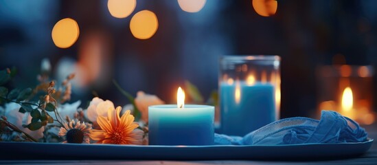 A tray adorned with electric blue candles and delicate flowers, creating a warm and inviting ambiance. The flickering flames and floral petals add an artistic touch to any event