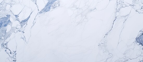 A close up of a white marble texture resembling snowcovered slopes with blue veins, creating an icy cap effect, reminiscent of freezing winter events