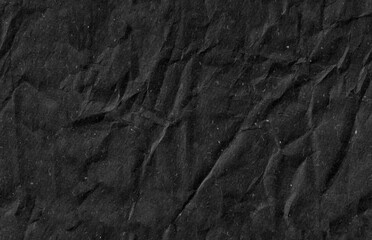 Seamless battered black kraft paper texture. Grunge rough natural page.