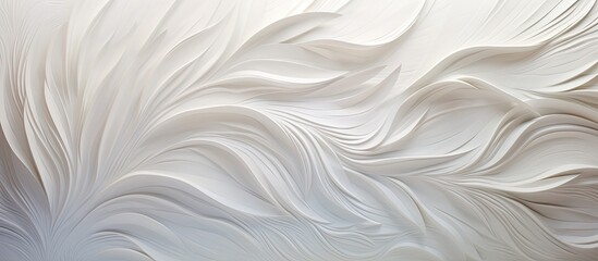 A close up of a white wall with a swirling pattern resembling liquid silk or creamy dairy. The wavelike art looks like feathers or fur