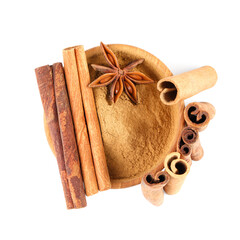 Dry aromatic cinnamon sticks, powder and anise star isolated on white, top view