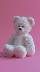 White teddy bear on pink background