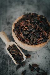 star anise raw materials on the wooden bowl, close up