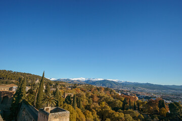 Beautiful autumn landscape of Sierra Nevada with snow capped mountains seen from the Alhambra,...