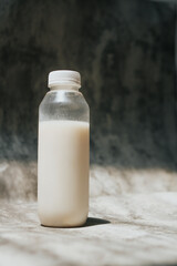 isolated white milk in the bottle with white background