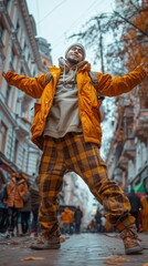 Fototapeta na wymiar Man in a yellow jacket and plaid pants stands smiling with arms outstretched on a city street