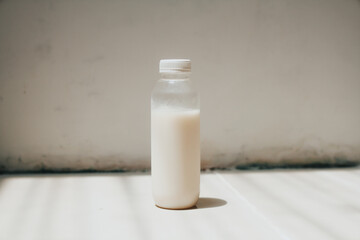 isolated white milk in the bottle with white background