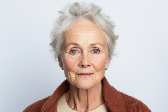 Portrait of a senior woman with wrinkles on her face looking at camera