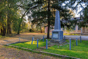 A cemetery with a large stone monument in the middle