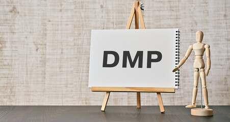 There is notebook with the word DMP. It is an abbreviation for Data Management Platform as eye-catching image.