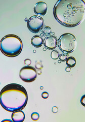 Minimal iridescent bubble background. Chromatic aberration silver bubbles floating in the air....