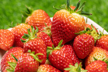 Fresh, delicious strawberries on the grass