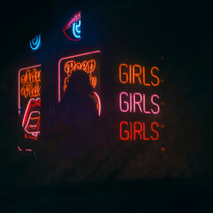 neon girls sign in the night