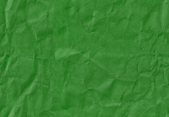 Seamless crumpled dark green craft paper texture. Old scrapbook paperboard.