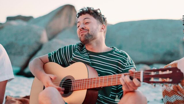 Guitar, man singing and friends relax on beach, musician and group of students on Spring break with music. Social gathering, reunion and hangout by the ocean, people celebrate and musical instrument