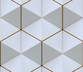 3D wall of white triangles with gold edges in the loft style assembled in hexagons and seamless ornament