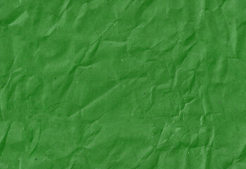 Seamless crumpled dark green kraft paper texture. Empty textured sheet.