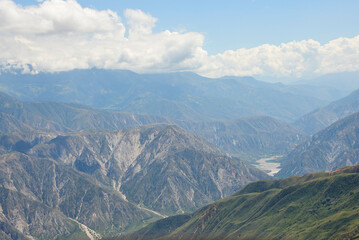 Fototapeta premium Aerial view, from a paraglider, of the Chicamocha Canyon, panoramic view of a spectacular mountain scenery in Santander, Colombia.