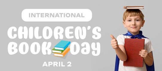 Banner for International Children's Book Day with cute little boy dressed as superhero