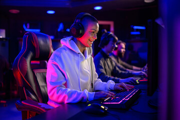 Bald woman eSports female gamer playing online strategy video game