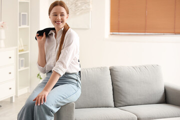 Young businesswoman resting at home after long working day