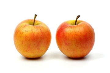 Two apples nestled closely together on a white background, showcasing their vibrant colors and organic shapes.