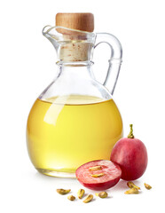 Bottle of grape seed oil and fresh ripe grapes with seeds - 758420730