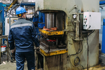 Operator working with hydraulic press