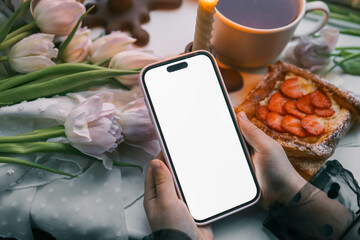 Phone with isolated screen on background of spring decor