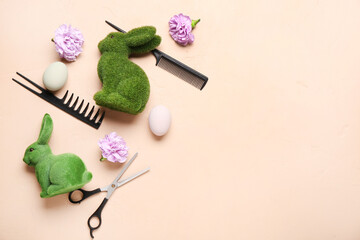 Fototapeta na wymiar Hairdressing accessories with flowers, Easter eggs and bunnies on beige background