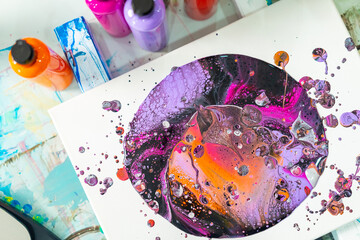 Young Asian generation z woman learning acrylic pouring art on canvas workshop at art studio. Happy people artist enjoy and fun indoor hobbies creating colorful abstract modern art painting in class.
