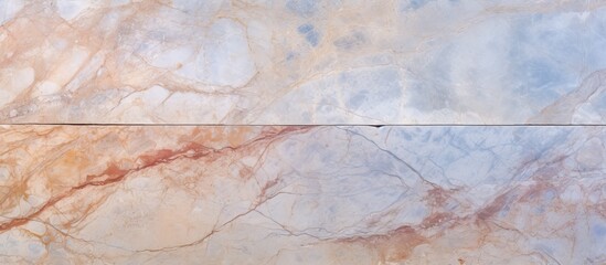 A close up of a peachcolored marble floor with a beautiful marble texture, adding elegance and sophistication to any building space