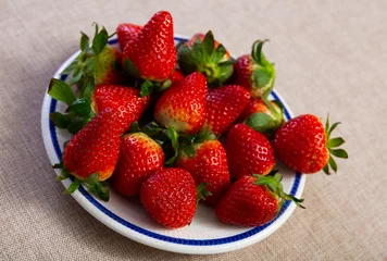 Fotobehang Ripe berries of fresh sweet strawberry in plate. Healthy vitamin food © JackF