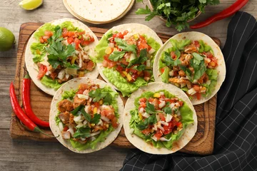 Fotobehang Delicious tacos with vegetables and meat on wooden table, flat lay © New Africa