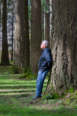 Man in the forest relaxing in nature.