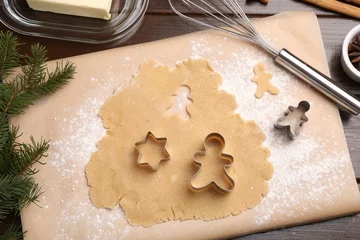 Foto op Plexiglas Making Christmas cookies. Flat lay composition with cutters and raw dough on wooden table © New Africa