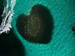 Aerial top view at Heart-shaped barrier reef. Caribbean Sea. Dominican Republic.