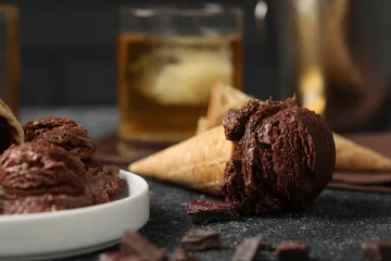 Foto op Plexiglas Tasty ice cream scoops, chocolate crumbs and waffle cones on dark textured table, closeup © New Africa