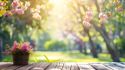 Rolgordijnen Spring Table With Trees In Blooming And Defocused Sunny Garden In Background © Uliana