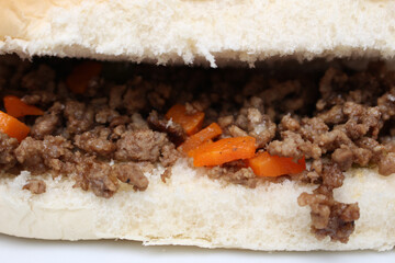 ground beef and carrot sandwich. meal details. meat sandwich with selective focus.